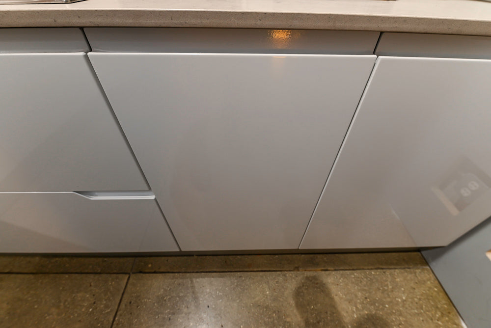 Lyon's Modern White and Natural Wood Toned Kitchenette with Silestone Countertops