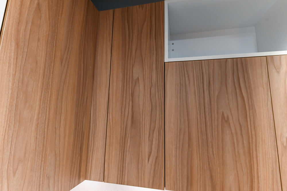 Lyon's Modern White and Natural Wood Toned Kitchenette with Silestone Countertops