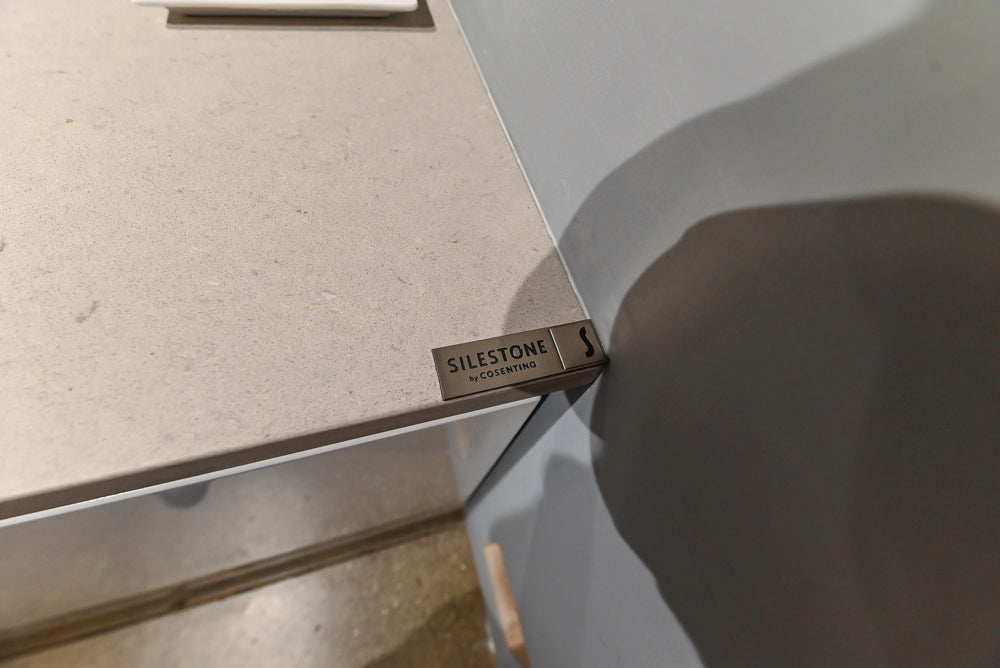 Lyon's Modern White and Natural Wood Toned Kitchenette with Silestone Countertops