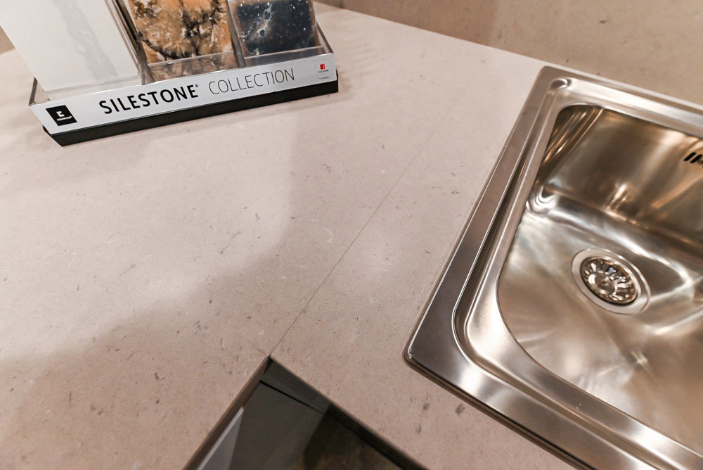 Lyon's Modern White and Natural Wood Toned Kitchenette with Silestone Countertops