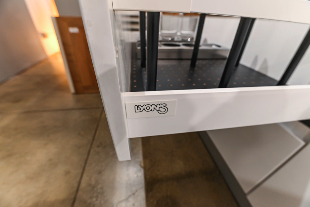 Lyon's Modern White and Natural Wood Toned Kitchenette with Silestone Countertops