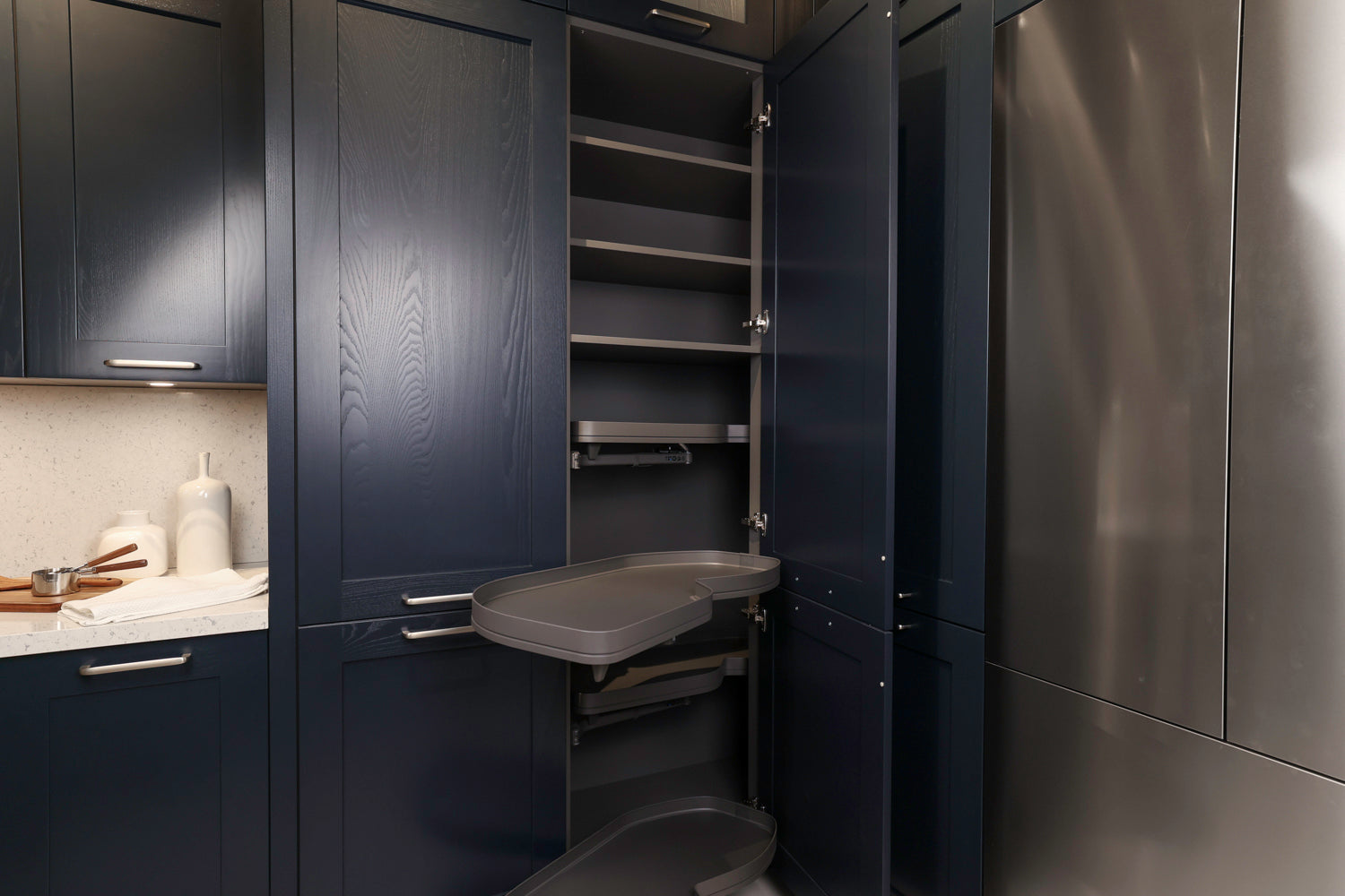 Häcker Velvet Blue & Light Grey Modern Kitchen with Island and Stone Countertops