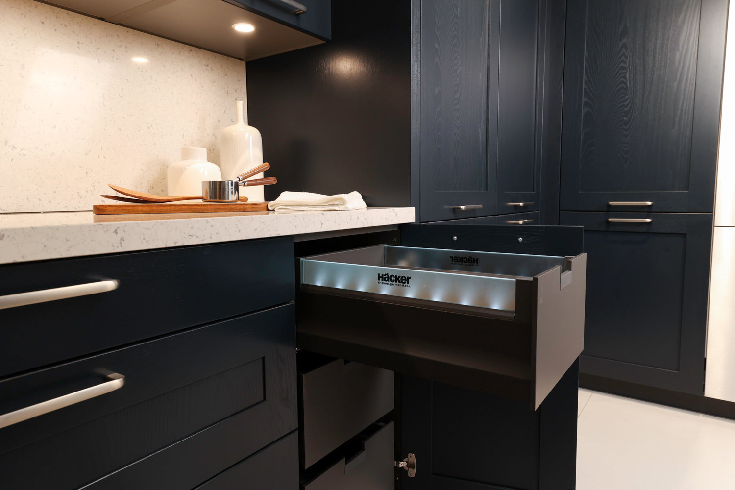 Häcker Velvet Blue & Light Grey Modern Kitchen with Island and Stone Countertops