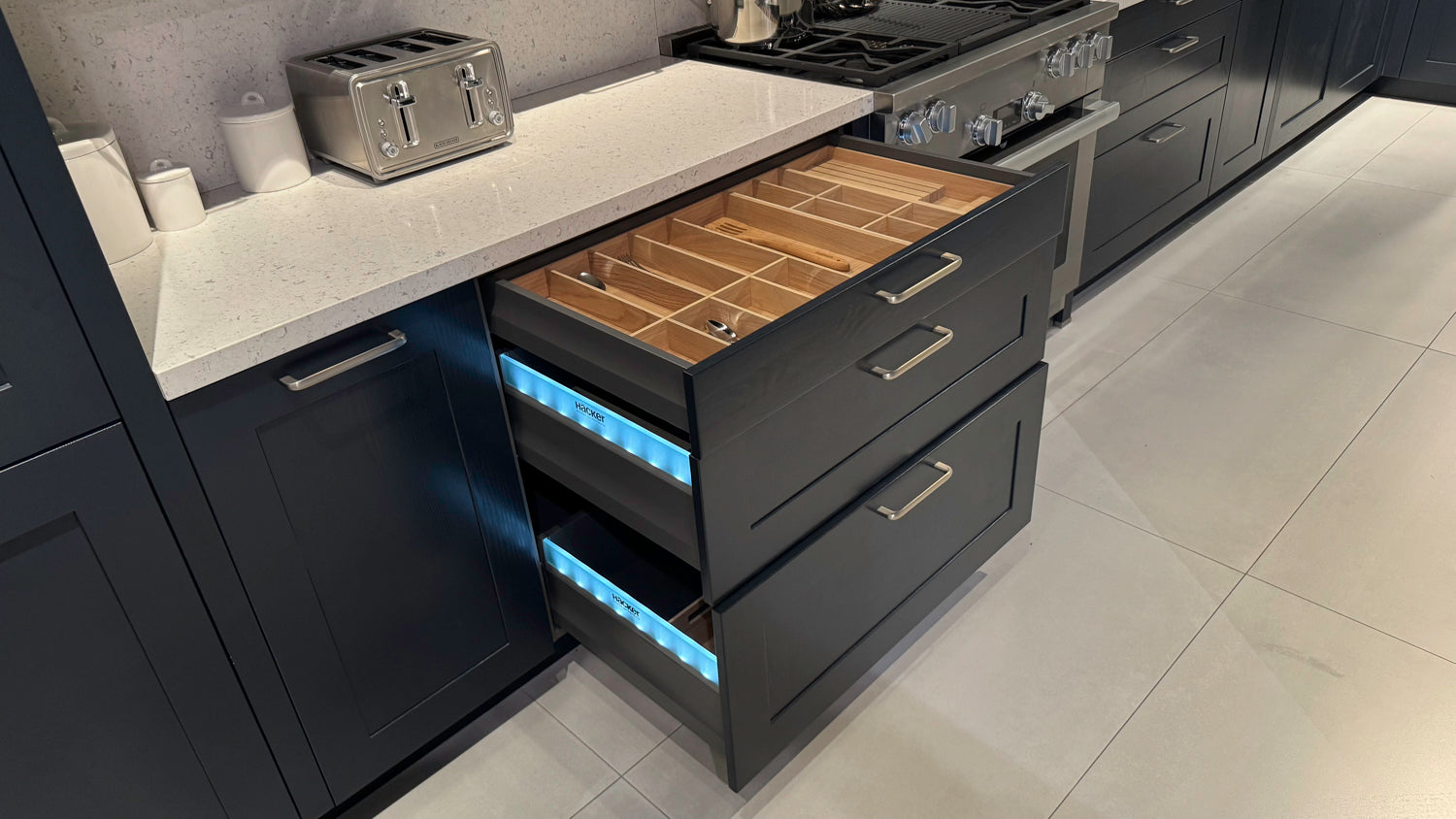 Häcker Velvet Blue & Light Grey Modern Kitchen with Island and Stone Countertops