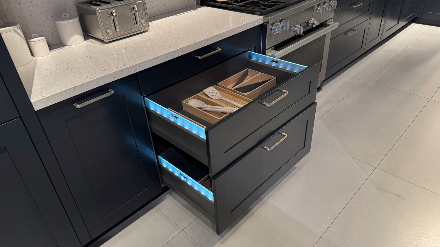 Häcker Velvet Blue & Light Grey Modern Kitchen with Island and Stone Countertops