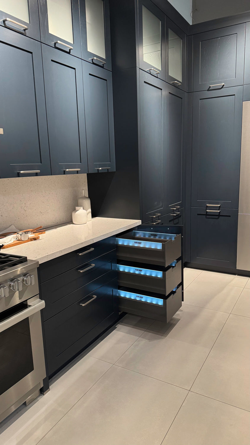 Häcker Velvet Blue & Light Grey Modern Kitchen with Island and Stone Countertops