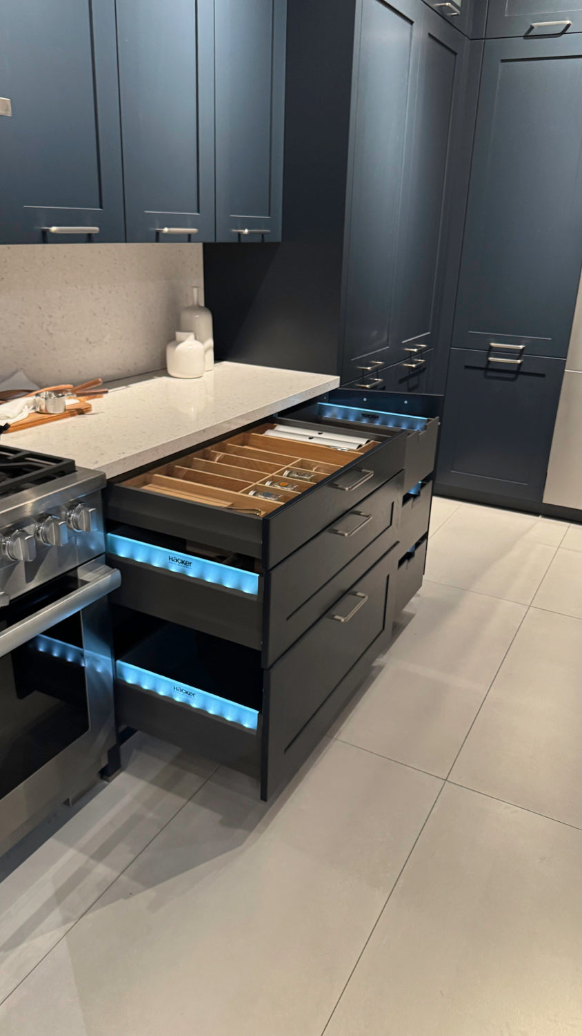 Häcker Velvet Blue & Light Grey Modern Kitchen with Island and Stone Countertops