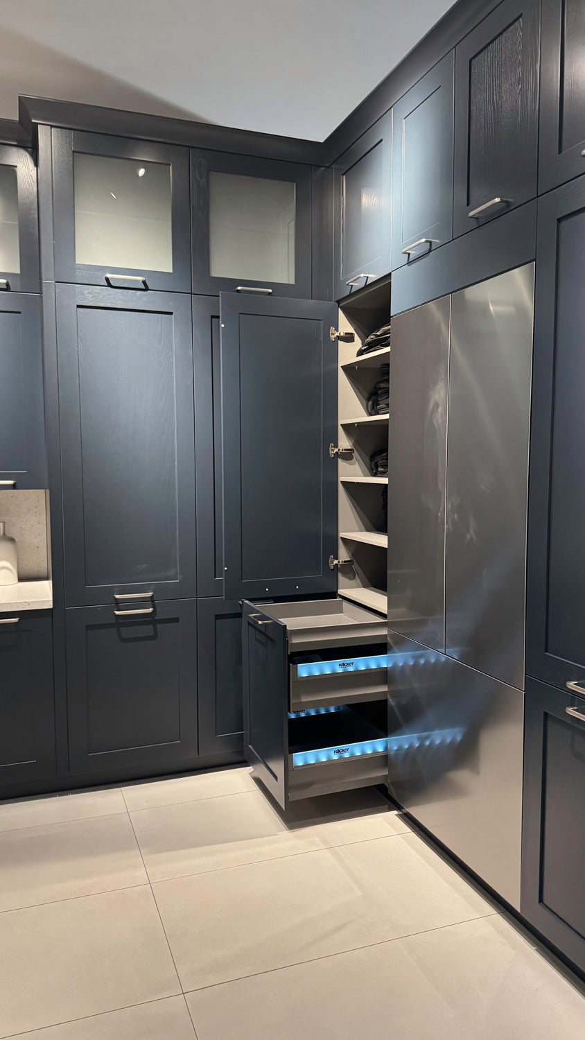 Häcker Velvet Blue & Light Grey Modern Kitchen with Island and Stone Countertops