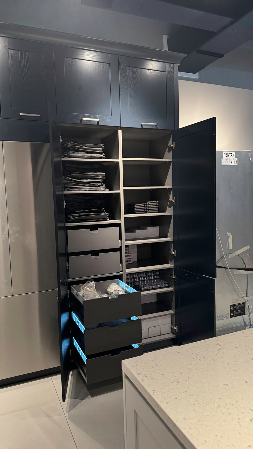 Häcker Velvet Blue & Light Grey Modern Kitchen with Island and Stone Countertops