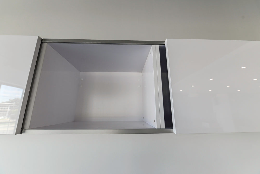 Häcker Modern Glossy White Kitchen with Island and Black Quartz Countertop