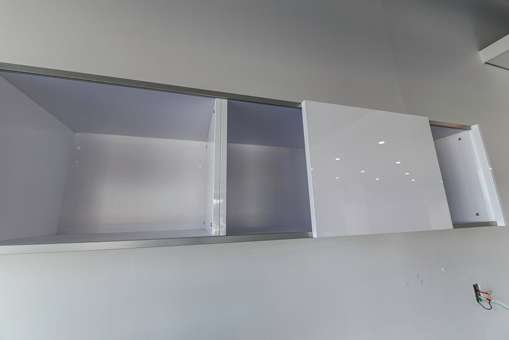 Häcker Modern Glossy White Kitchen with Island and Black Quartz Countertop