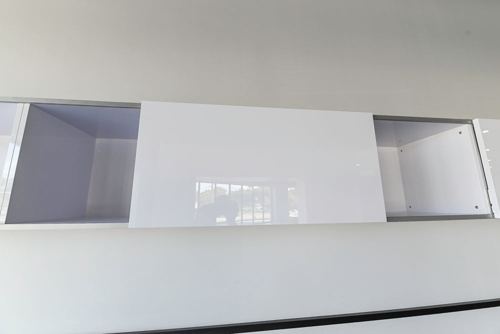 Häcker Modern Glossy White Kitchen with Island and Black Quartz Countertop