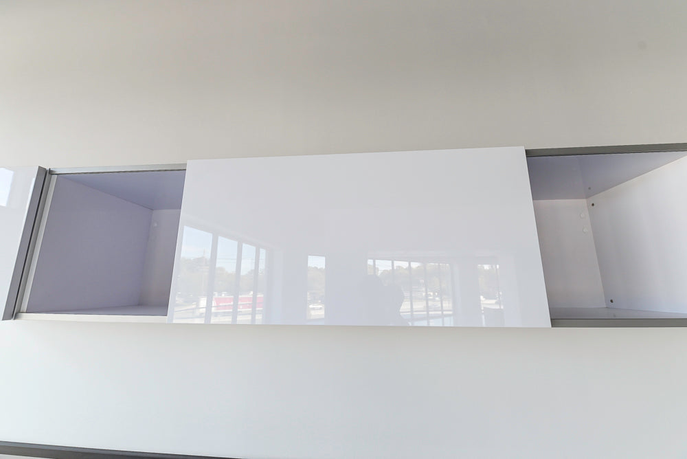 Häcker Modern Glossy White Kitchen with Island and Black Quartz Countertop