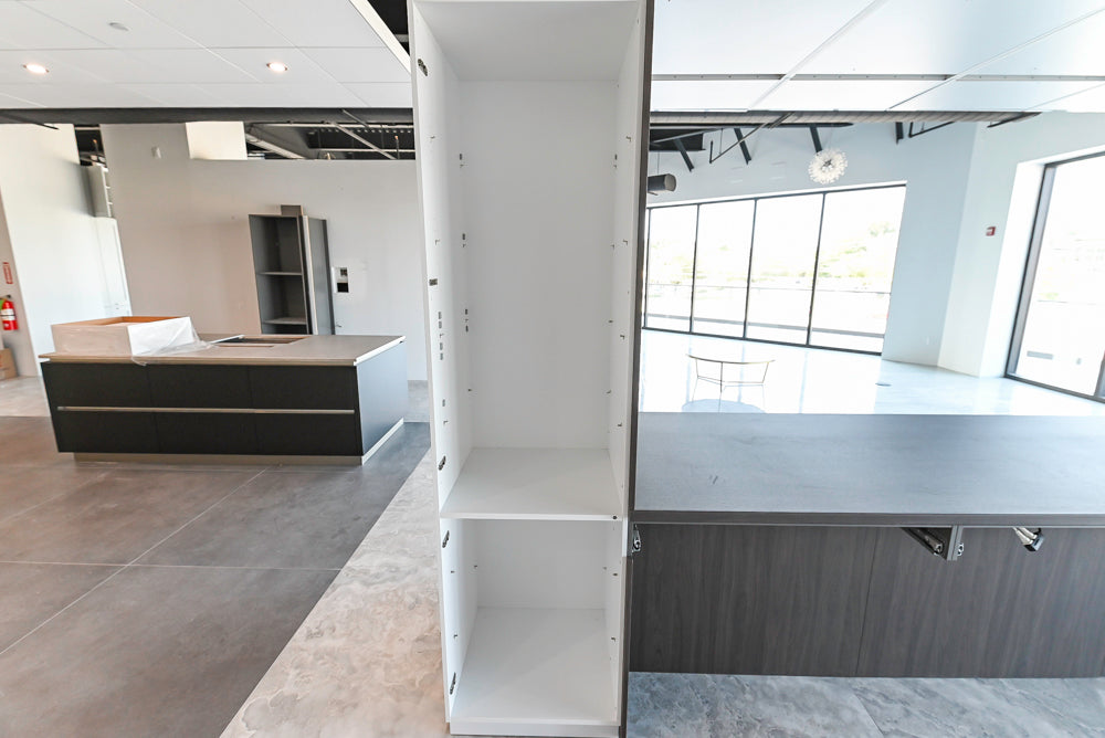 Häcker Modern Glossy White Kitchen with Island and Black Quartz Countertop