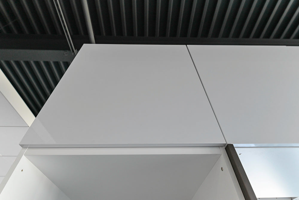 Häcker Modern Glossy White Kitchen with Island and Black Quartz Countertop