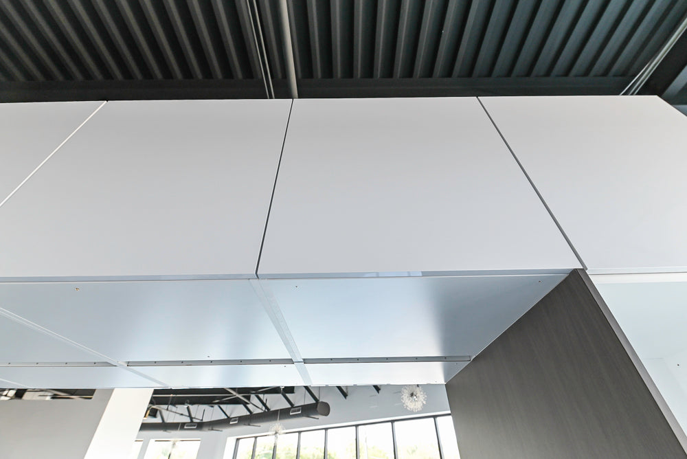 Häcker Modern Glossy White Kitchen with Island and Black Quartz Countertop