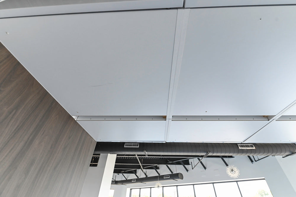 Häcker Modern Glossy White Kitchen with Island and Black Quartz Countertop