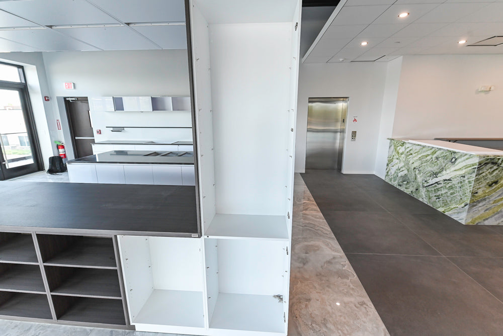 Häcker Modern Glossy White Kitchen with Island and Black Quartz Countertop