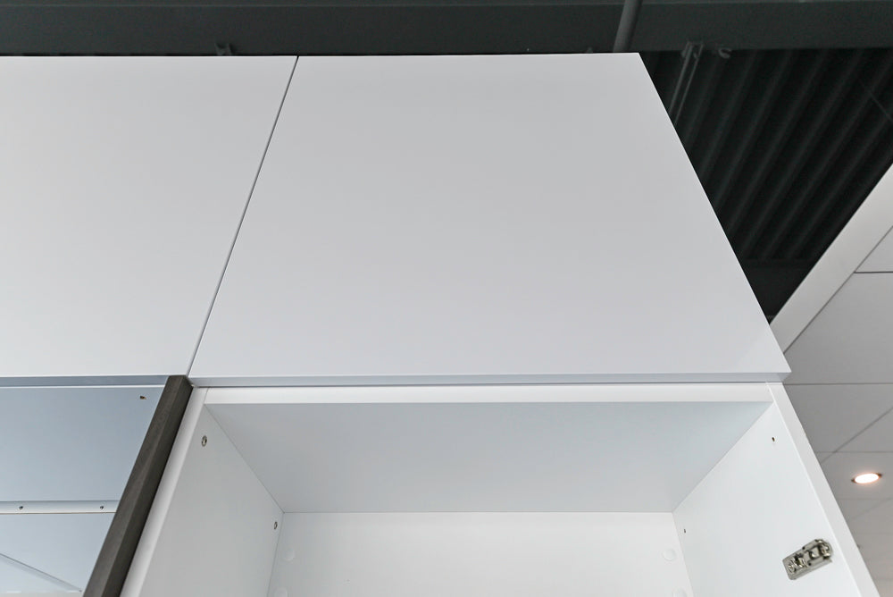 Häcker Modern Glossy White Kitchen with Island and Black Quartz Countertop