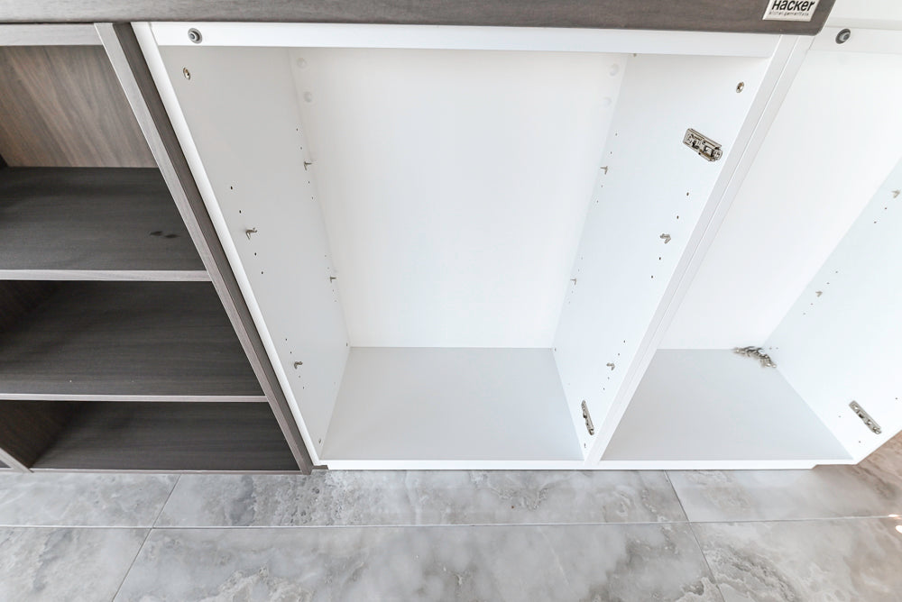 Häcker Modern Glossy White Kitchen with Island and Black Quartz Countertop