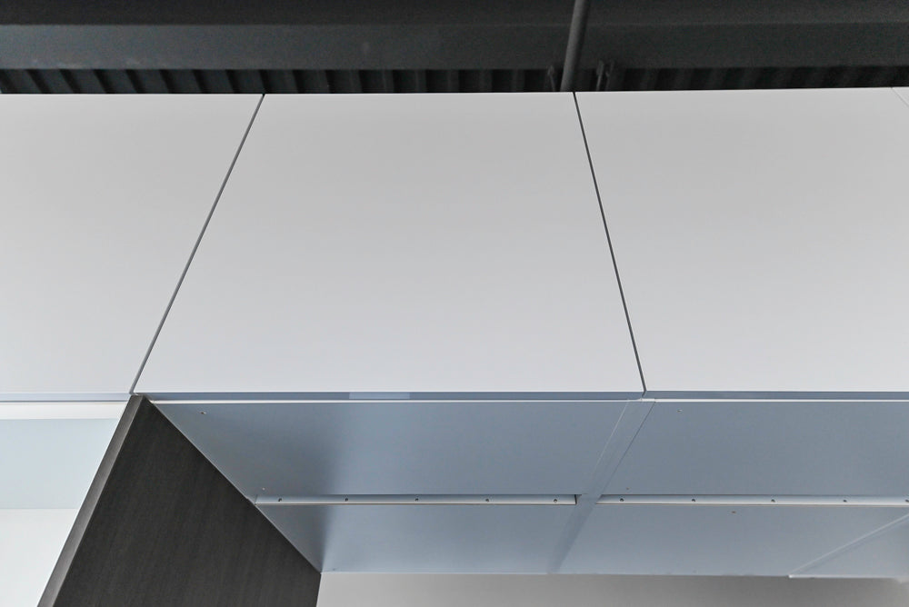 Häcker Modern Glossy White Kitchen with Island and Black Quartz Countertop