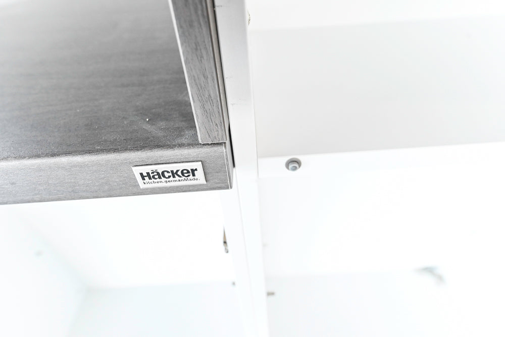 Häcker Modern Glossy White Kitchen with Island and Black Quartz Countertop