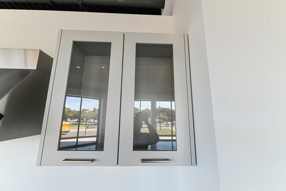 Häcker Transitional Light Grey Kitchen with Dark Grey Island and White Quartz Countertops