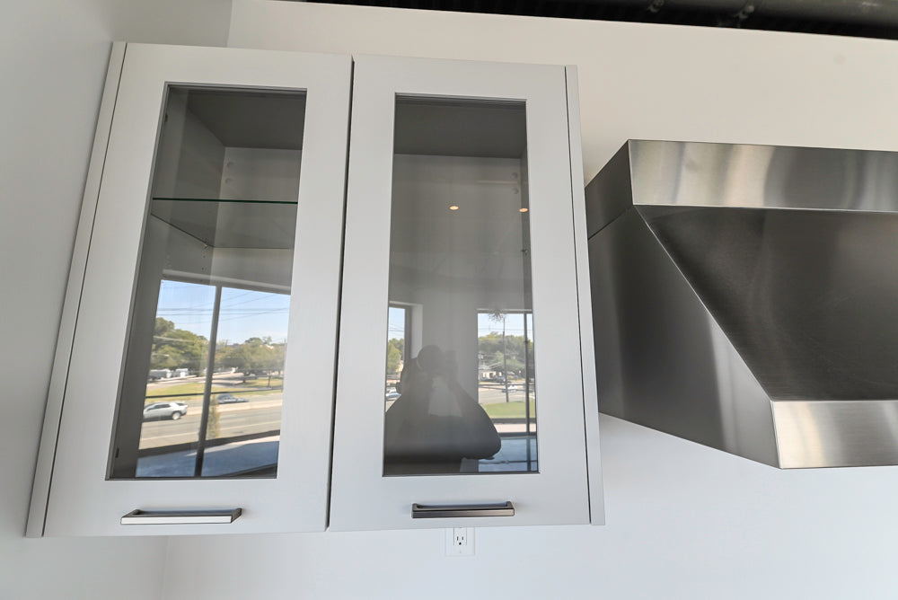 Häcker Transitional Light Grey Kitchen with Dark Grey Island and White Quartz Countertops
