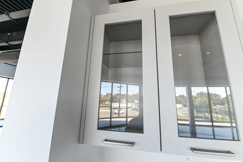 Häcker Transitional Light Grey Kitchen with Dark Grey Island and White Quartz Countertops