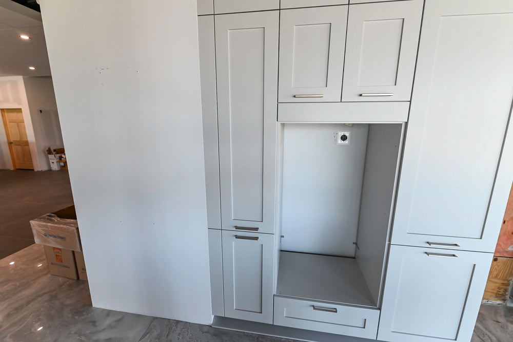 Häcker Transitional Light Grey Kitchen with Dark Grey Island and White Quartz Countertops