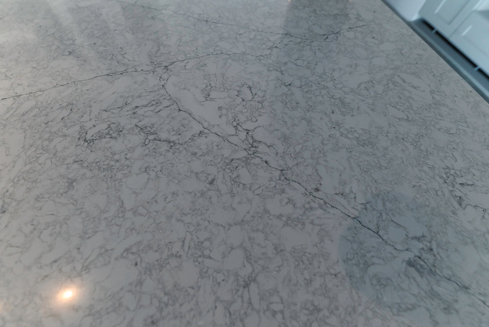 Häcker Transitional Light Grey Kitchen with Dark Grey Island and White Quartz Countertops