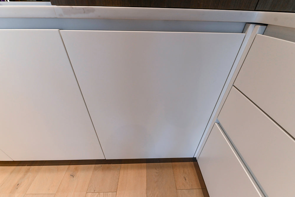 Composit Modern White & Brown Wood Veneer Kitchen with Enigma Countertops and Wolf Cooktop