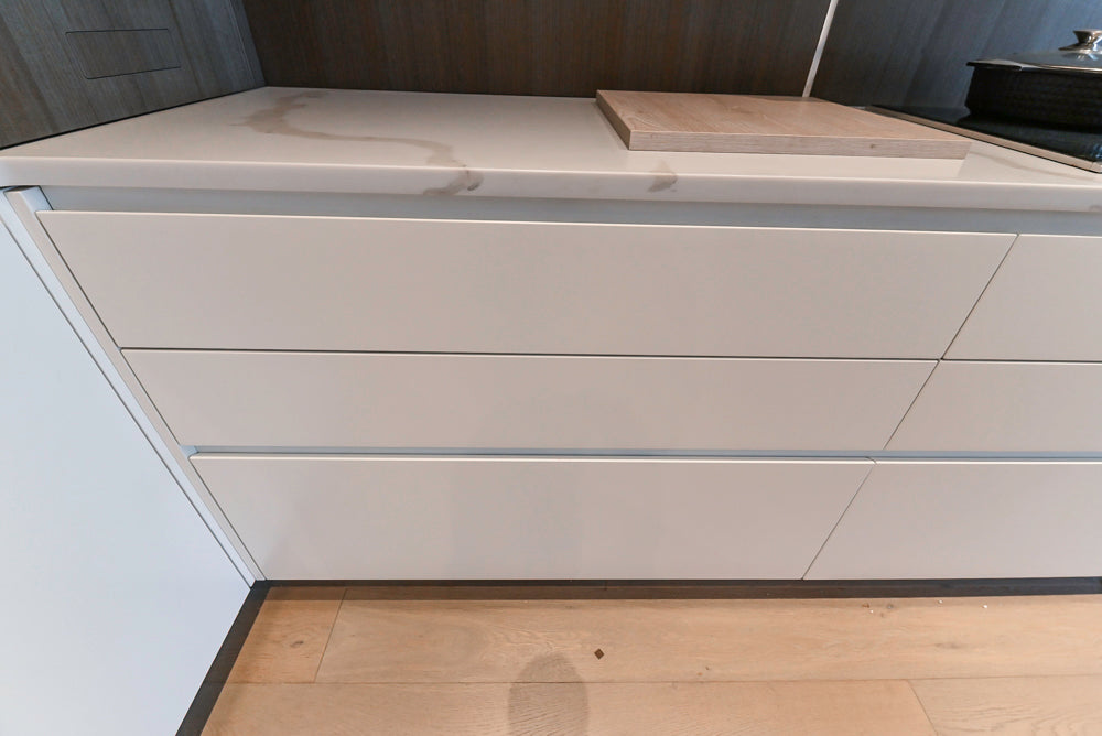 Composit Modern White & Brown Wood Veneer Kitchen with Enigma Countertops and Wolf Cooktop