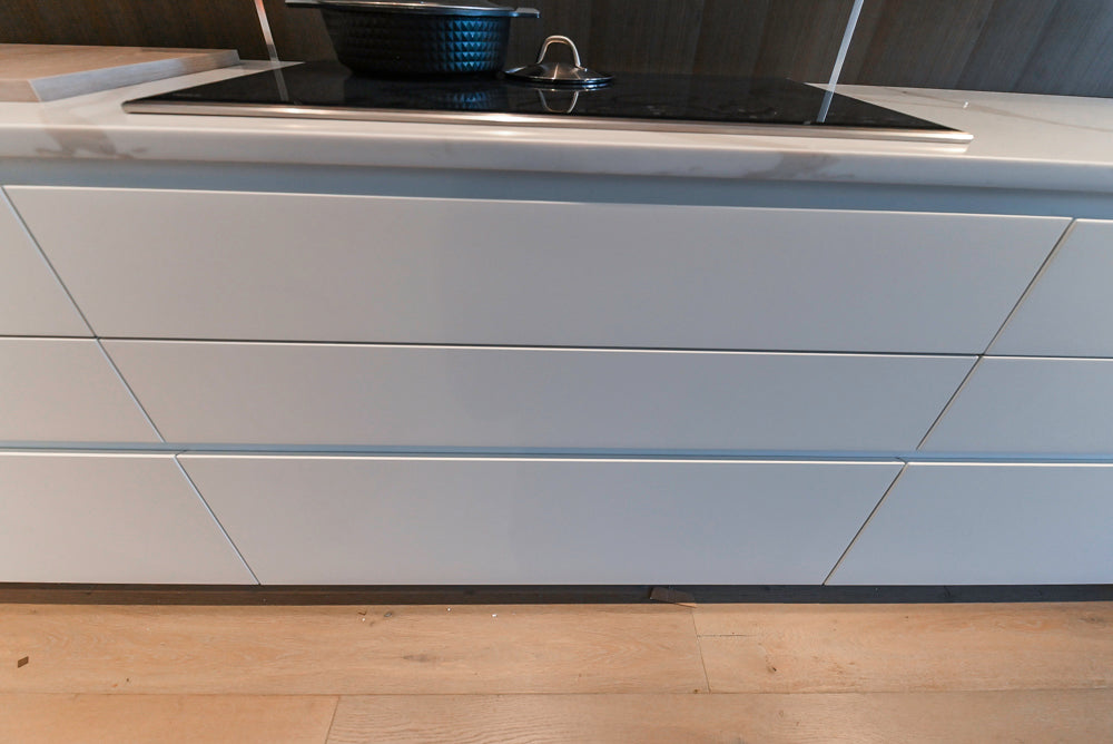 Composit Modern White & Brown Wood Veneer Kitchen with Enigma Countertops and Wolf Cooktop