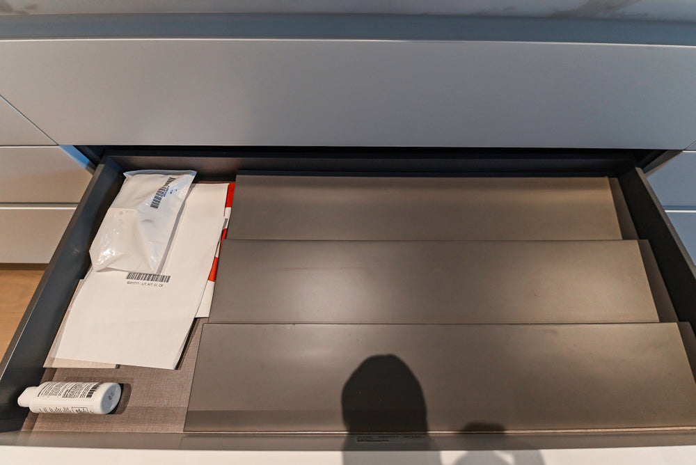 Composit Modern White & Brown Wood Veneer Kitchen with Enigma Countertops and Wolf Cooktop