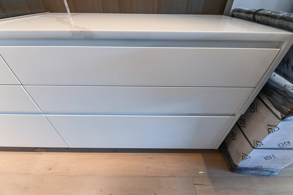 Composit Modern White & Brown Wood Veneer Kitchen with Enigma Countertops and Wolf Cooktop