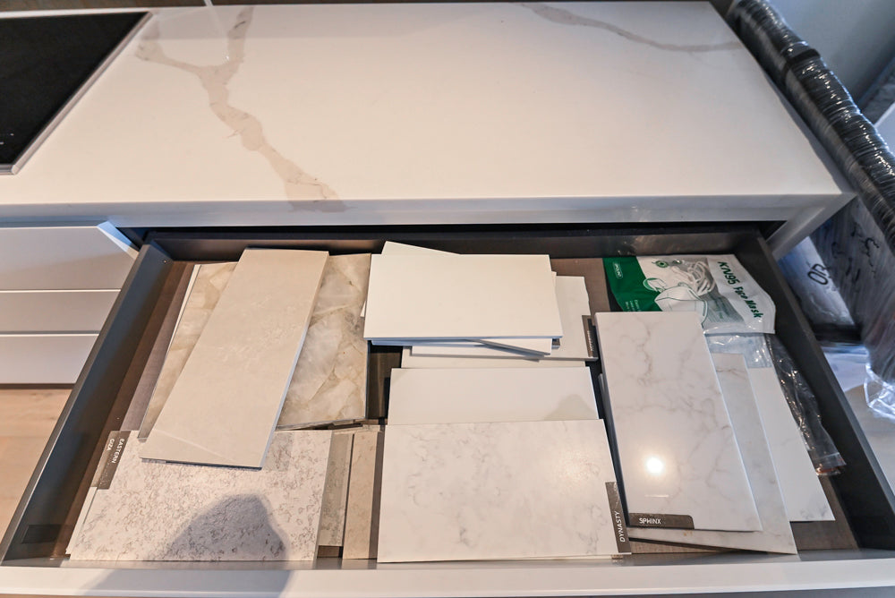 Composit Modern White & Brown Wood Veneer Kitchen with Enigma Countertops and Wolf Cooktop