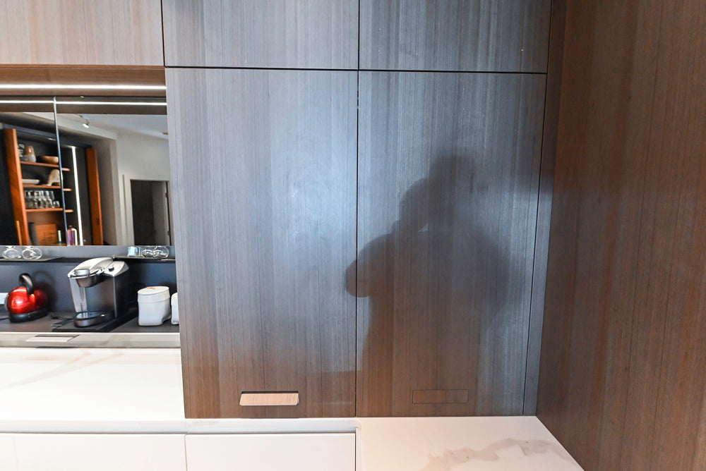 Composit Modern White & Brown Wood Veneer Kitchen with Enigma Countertops and Wolf Cooktop