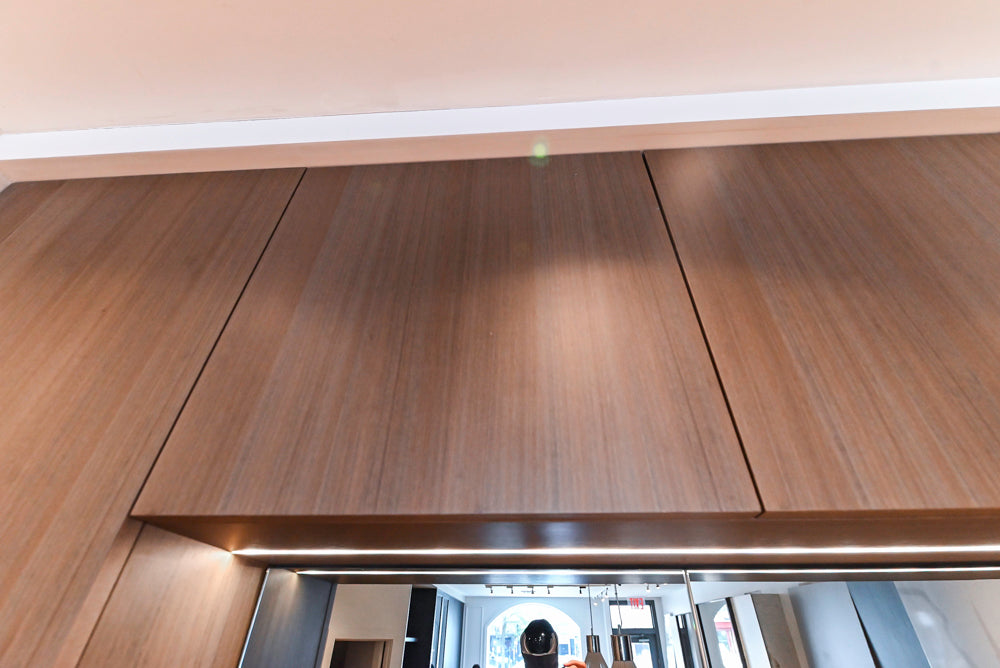 Composit Modern White & Brown Wood Veneer Kitchen with Enigma Countertops and Wolf Cooktop