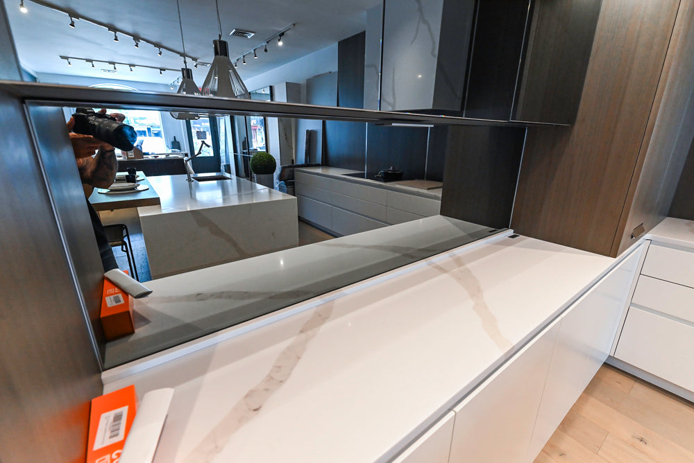 Composit Modern White & Brown Wood Veneer Kitchen with Enigma Countertops and Wolf Cooktop