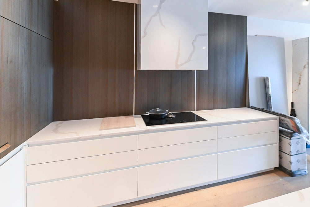 Composit Modern White & Brown Wood Veneer Kitchen with Enigma Countertops and Wolf Cooktop