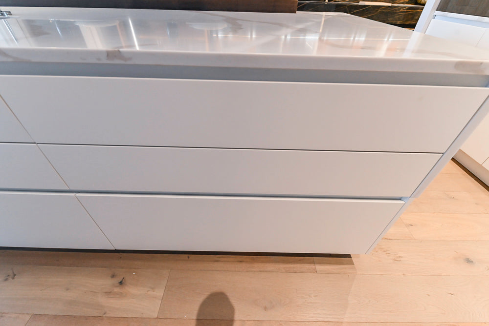 Composit Modern White & Brown Wood Veneer Kitchen with Enigma Countertops and Wolf Cooktop