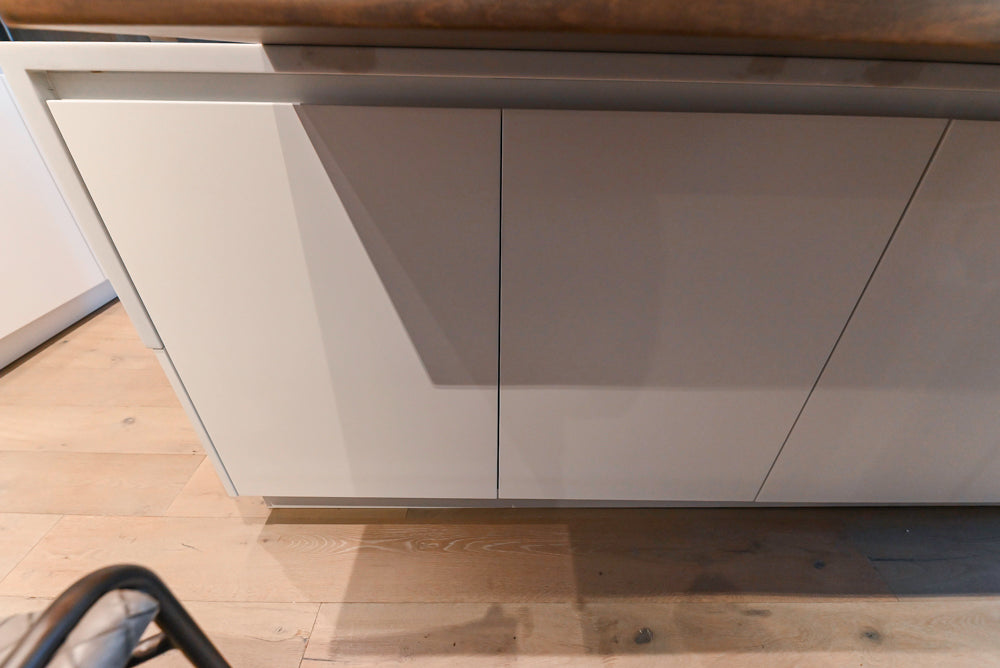 Composit Modern White & Brown Wood Veneer Kitchen with Enigma Countertops and Wolf Cooktop