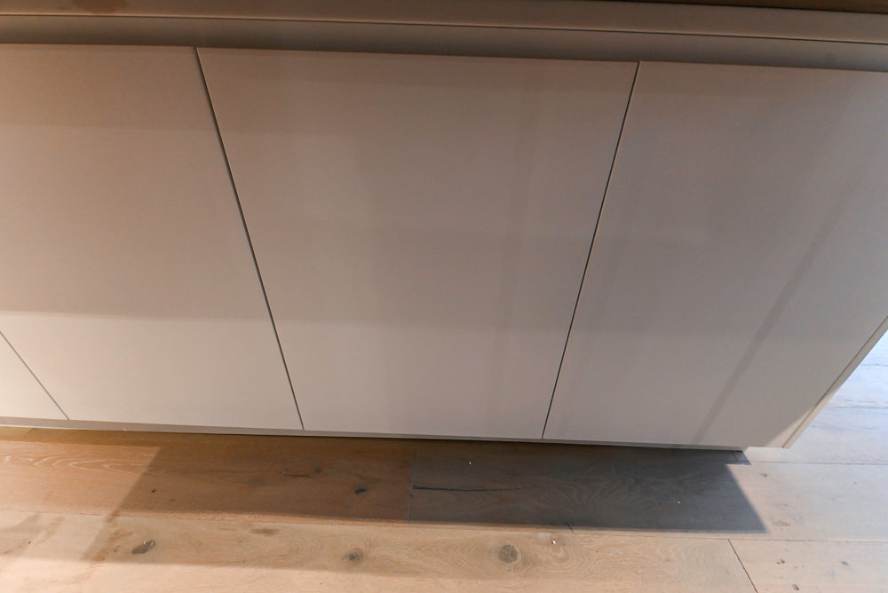 Composit Modern White & Brown Wood Veneer Kitchen with Enigma Countertops and Wolf Cooktop