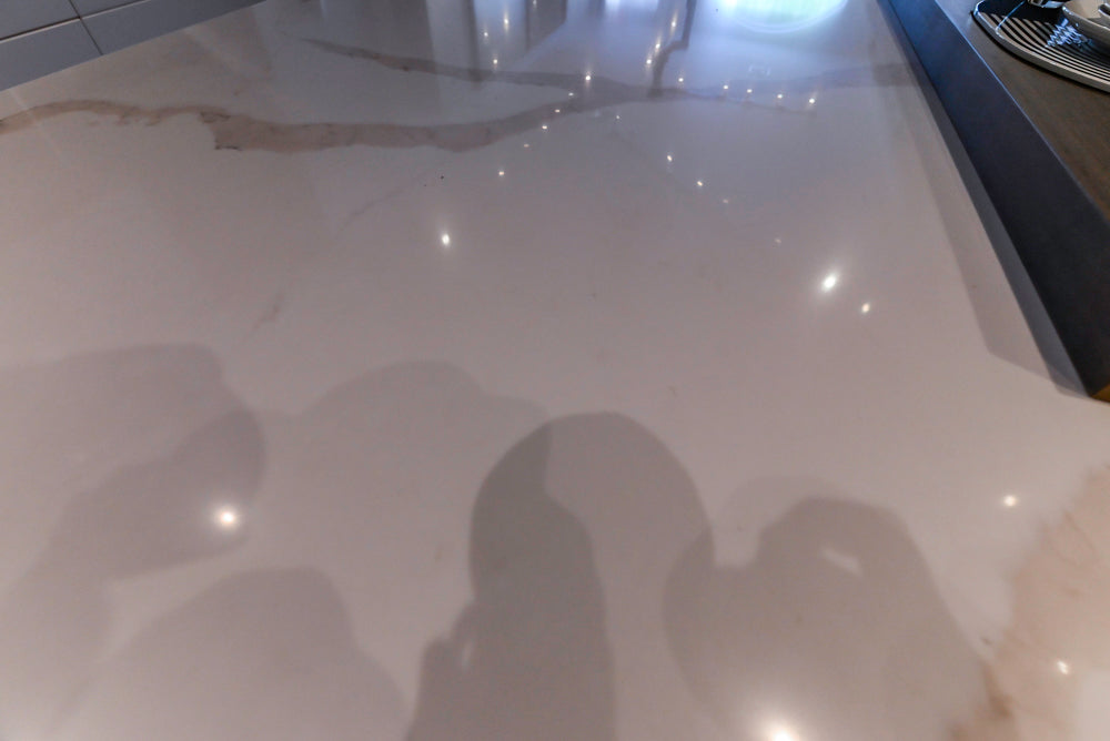 Composit Modern White & Brown Wood Veneer Kitchen with Enigma Countertops and Wolf Cooktop