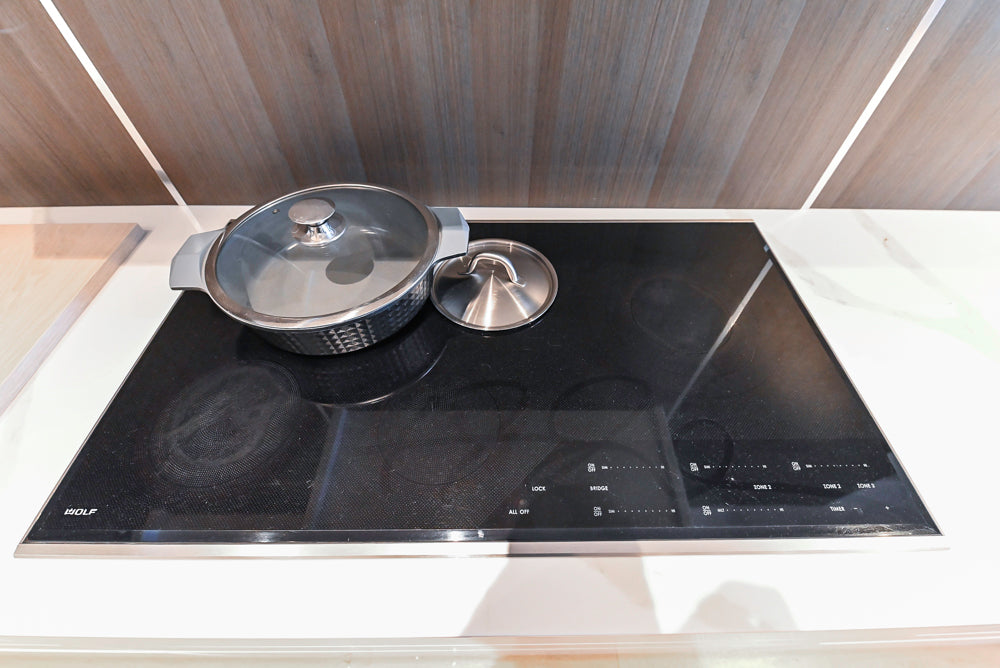 Composit Modern White & Brown Wood Veneer Kitchen with Enigma Countertops and Wolf Cooktop