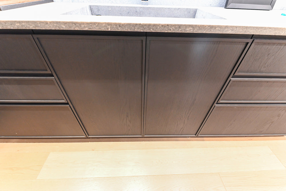 DOCA Modern Dark Brown Wood Veneer Kitchen Corner with White Ceasarstone Countertop & Integrated Sink