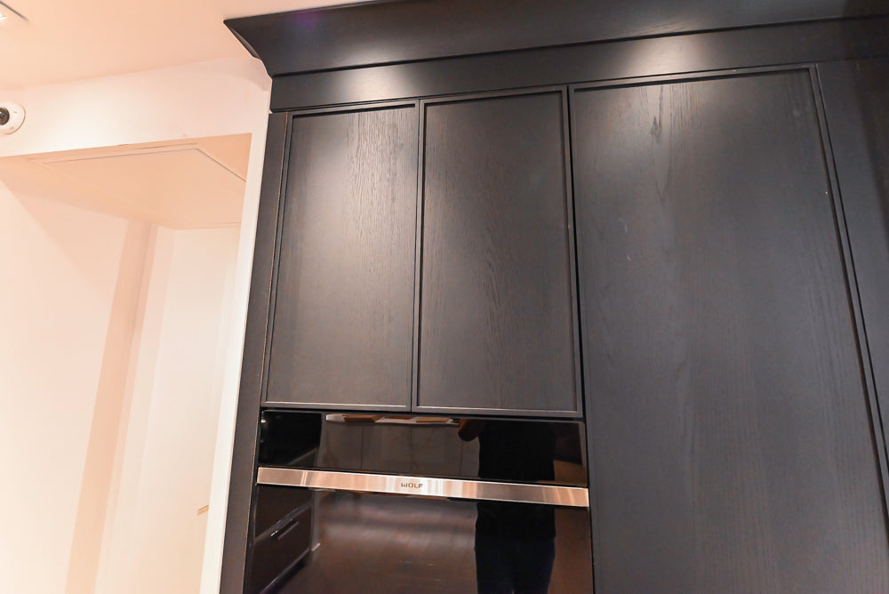 DOCA Modern Dark Brown Wood Veneer Kitchen Corner with White Ceasarstone Countertop & Integrated Sink