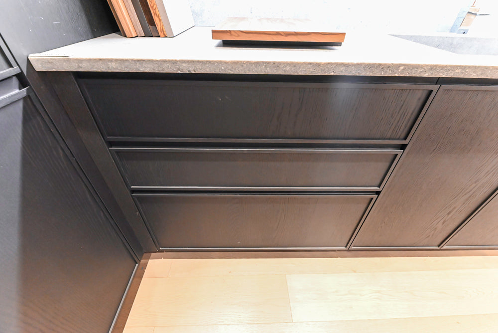 DOCA Modern Dark Brown Wood Veneer Kitchen Corner with White Ceasarstone Countertop & Integrated Sink