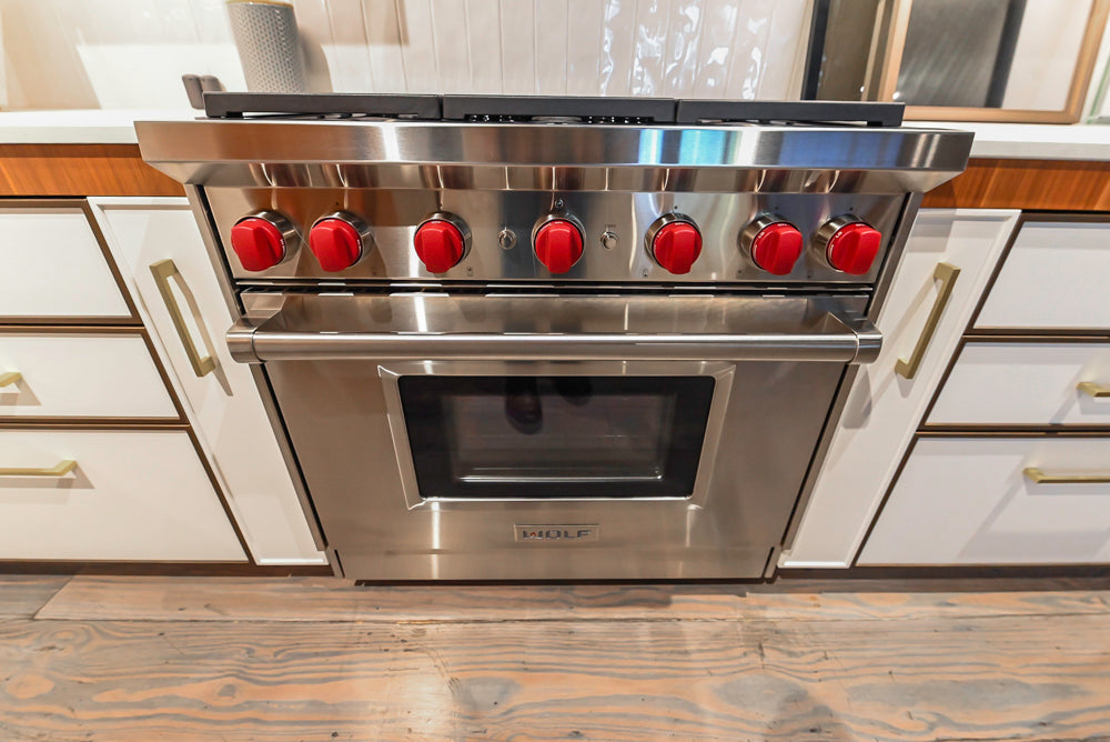 Wolf GR366 Professional 36 inch pro style gas convection range front view stainless steel with red knobs